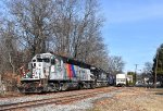 The NJT 4104 and C&D 2006 lead the train alongside Franklin Avenue